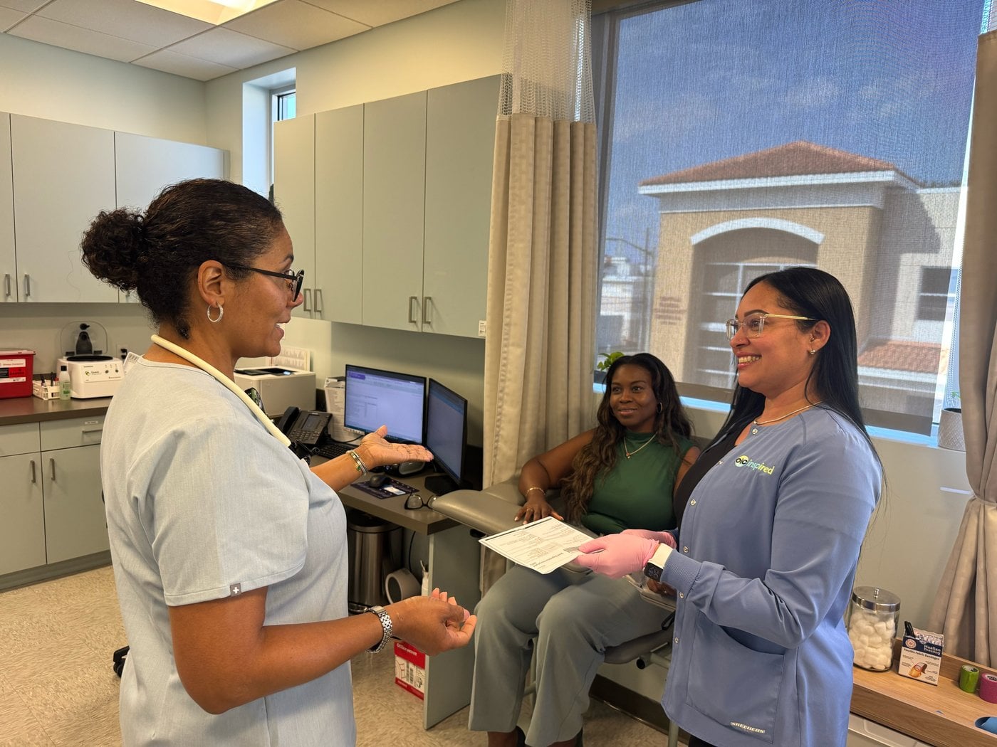 OIC study team members in an exam room
