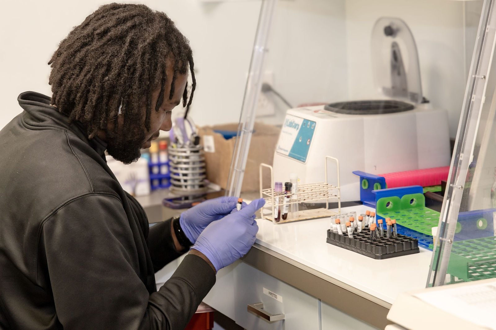 An OIC lab technician processes study samples in the research lab